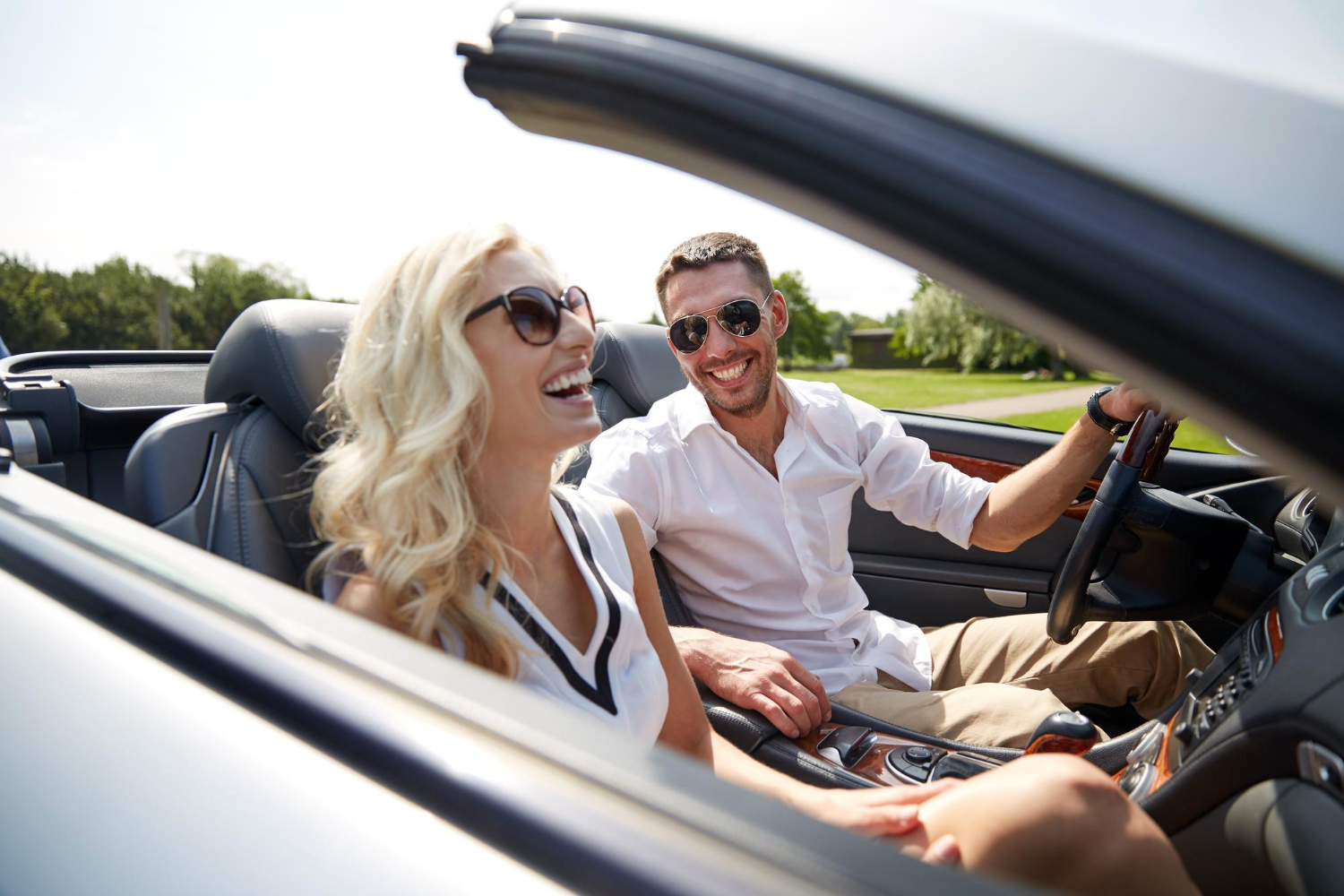 Tayla and Marcus enjoying a drive in a convertible